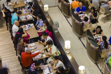 Hong Kong, China - May 31, 2015: People dining in a fast food restaurant in Citywalk, a famous shopping centre in Tsuen Wan, Hong Kong.のeditorial素材
