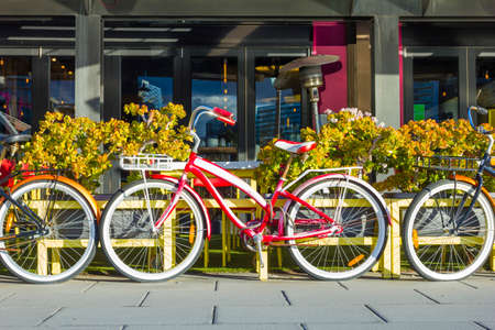 Vintage bicycles with baskets in front of a restaurantの写真素材