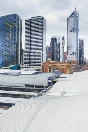 Melbourne, Australia - July 25, 2015: View of Southern Cross Station in Melbourne with skyscrapers. It is the major railway station and transport hub in Melbourne.のeditorial素材