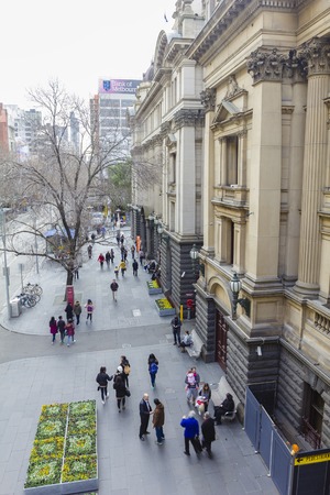 Melbourne, Australia - July 26, 2015: People walking outside Melbourne Town Hall, a heritage building in Melbourne in winter.のeditorial素材