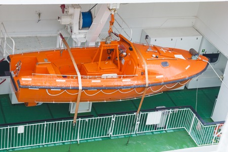 View of modern safety lifeboat carried by a cruise ship for use in emergency evacuation