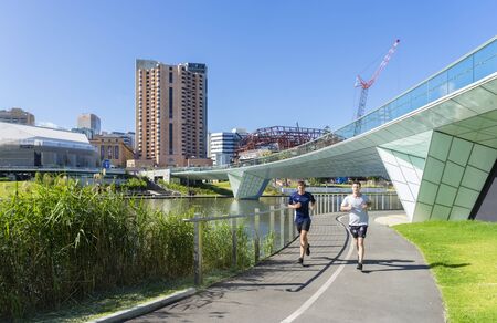 Adelaide, Australia - November 27, 2015: Two men doing exercise in the Riverbank Precinct of...