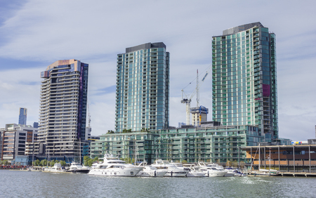 Melbourne, Australia - July 25, 2015: Modern waterfront apartments and yachts in marina in Docklands, Melbourne during daytime.のeditorial素材