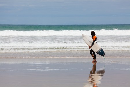 Victoria, Australia - November 22, 2015: View of surfer at the beach in Torquay, along the Great Ocean Road, during daytime.のeditorial素材