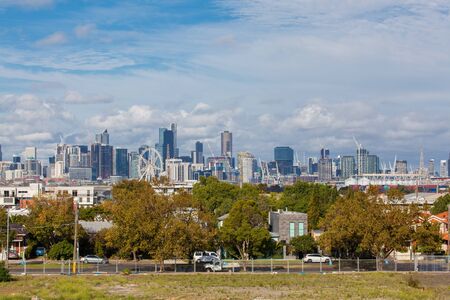 Melbourne, Australia - April 11, 2016: View of downtown Melbourne with modern buildings, Melbourne Star Observation Wheel and buildings under construction during daytime.のeditorial素材