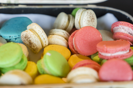 Close-up of colourful French macarons randomly placed in a boxの写真素材