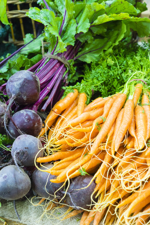 Fresh dutch carrots and beetroots in local farmers marketの写真素材