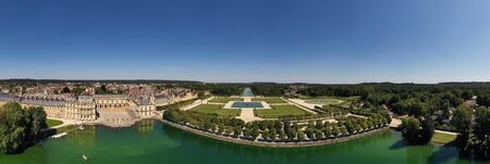 Aerial view of medieval landmark royal hunting castle Fontainbleau near Paris in France and lake with white swansの写真素材