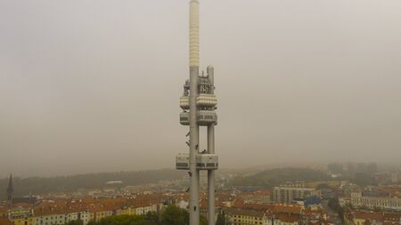 Aerial view of citycape of old town of Prague, with a lot of rooftops, churches, and the landmark of...