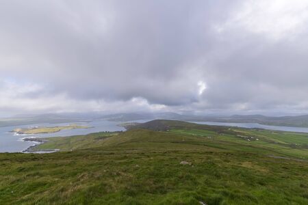 Beautiful aerial view of Beginish Island. Locations worth visiting on the Wild Atlantic Way. Scenic Irish countyside on sunny summer day, County Kerry, Ireland.の写真素材
