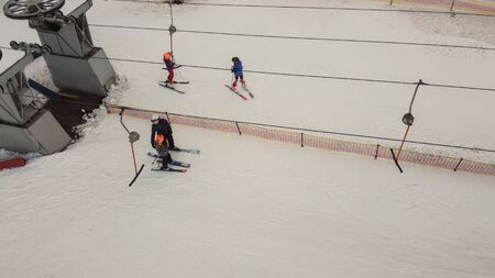 Aerial view of downhill skiing at local ski resort. Ski lift. Russia, Leningrdaskaya oblast, village Korobitsyno near Saint Petersburg.の写真素材