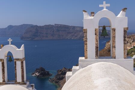 Santorini Church Bells at Oia village look out to Aegean sea, Santorini, Greece
