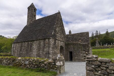 Monastic cemetery of Glendalough, Ireland. Famous ancient monastery in the wicklow mountains with a beautiful graveyard from the 11th centuryの写真素材