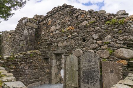 Monastic cemetery of Glendalough, Ireland. Famous ancient monastery in the wicklow mountains with a beautiful graveyard from the 11th centuryの写真素材