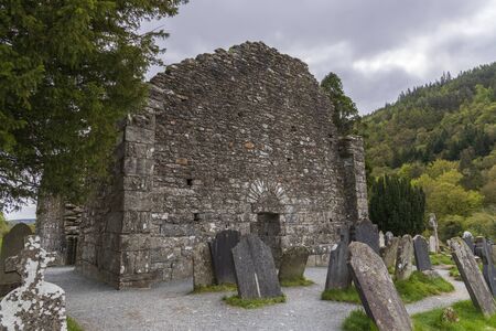 Monastic cemetery of Glendalough, Ireland. Famous ancient monastery in the wicklow mountains with a beautiful graveyard from the 11th centuryの写真素材