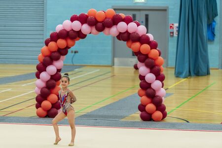 Portrait of a young gymnast. Portrait of a 7 years old girl in rhythmic gymnastics competitionsの写真素材