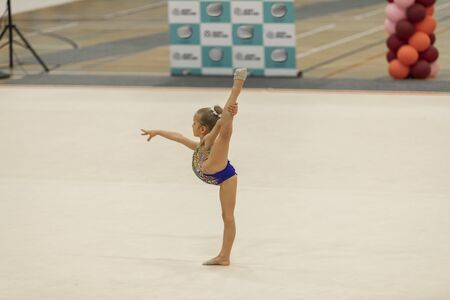 Portrait of a young gymnast. Portrait of a 7 years old girl in rhythmic gymnastics competitionsの写真素材
