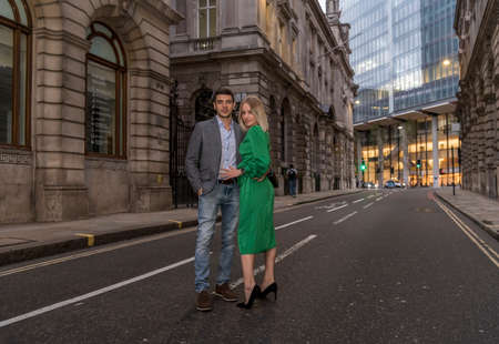 Young flirty couple posing on a street of City in London, UKの写真素材