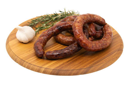 Coiled cumberland sausage with garlic rustic boardの写真素材