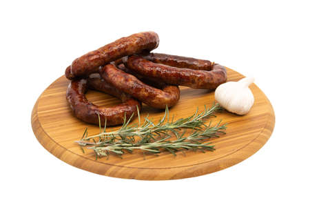 Coiled cumberland sausage with garlic rustic boardの写真素材