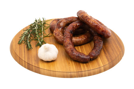 Coiled cumberland sausage with garlic rustic boardの写真素材