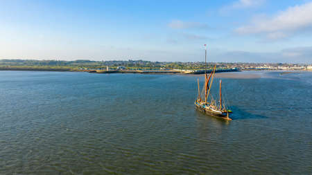 Beautiful aerial view on vintage caravel on sunlit sea water. Scenic travel concept, Brightlingsea, Essex, UKの写真素材
