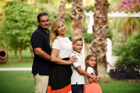 A happy family with kids in the parkの写真素材