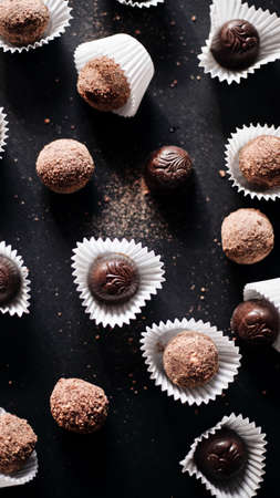 Assortment of fine chocolate candies, white, dark, and milk chocolateの写真素材