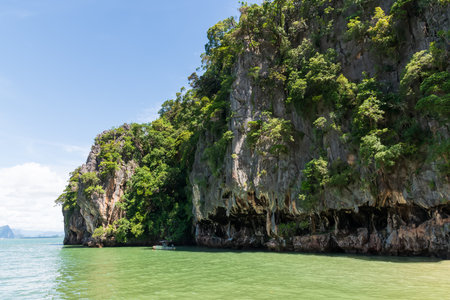 Experience the Stunning Rocky Shoreline Accompanied by Lush Greenery Right by the Waters Edge, Thailand, James Bond Islandの写真素材