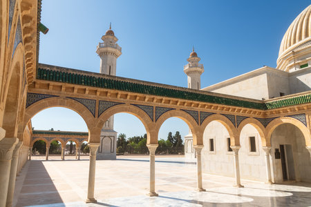 Experience the stunning and exquisite architecture of a grand mosque featuring beautiful archesの写真素材