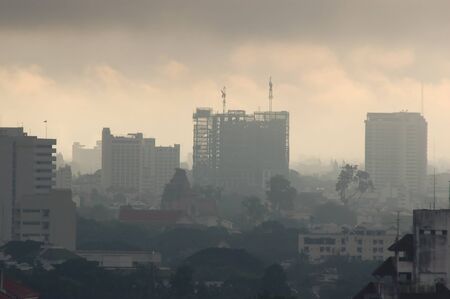 The smoke from forest fire cover the cityの写真素材