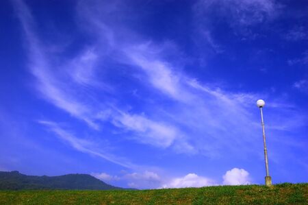 A cloud float over the hillの写真素材