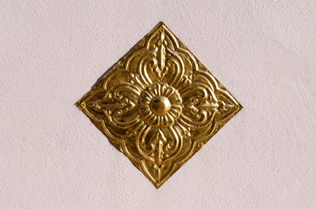 A carved brass plate use to decorate in Buddhist templeの写真素材