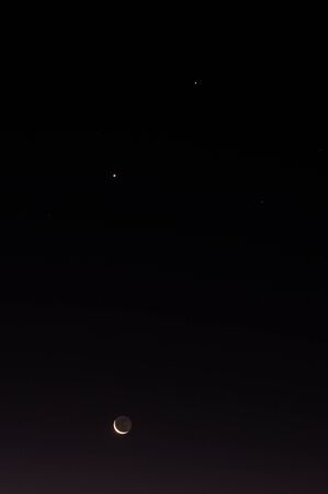 A moon and the stars in the night skyの写真素材