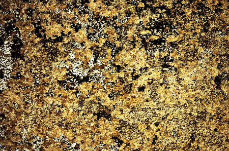 Gold color grunge stained on cement wall, a close up image of a grunge stained on a cement wall present a detail of texture and pattern of grunge stained in a cement wall, can use for a backgroundの写真素材