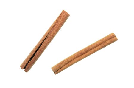 Isolated cinnamon/cannella stick, top view closeup photo of cinnamon/cannella stick isolated on white background, two sticks of cinnamon/cannella, food accessories, food ingredient, food condimentの写真素材