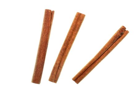 Isolated cinnamon/cannella stick, top view closeup photo of cinnamon/cannella stick isolated on white background, three sticks of cinnamon/cannella, food accessories, food ingredient, food condimentの写真素材