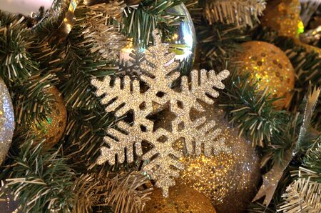 Christmas tree decoration, christmas tree that decorate by silver snowflakes, and golden xmas balls for celebration in christmas time, xmas background, xmas celebrate, card backgroundの写真素材