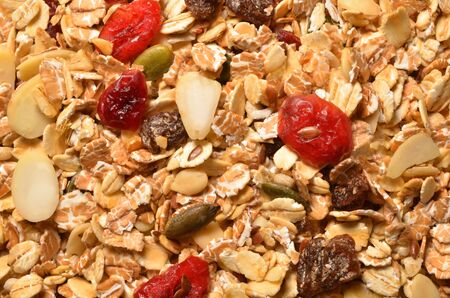 Granola texture, muesli texture, a top view close photo image on granola or muesli pile present a detail in top view of granola or muesli texture, a cereal grain healthy food, can use for backgroundの写真素材