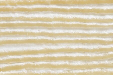 Crape cake, side view closeup image on sliced surface of crape cake present detail of crape cake layer texture and pattern that consist of crape layer alternate with cream layer, pattern backgroundの写真素材