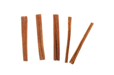 Isolate cinnamon/cannella stick, top view closeup photo image of cinnamon/cannella stick isolated on white background, five cinnamon/cannella sticks , food accessories, food ingredient, food condimentの写真素材
