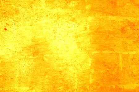 Blur abstract photo image of bright gold color light reflect from a gold color metal wall that cover with gold leaf foil for vergolden a wall, can use as a backgroundの写真素材