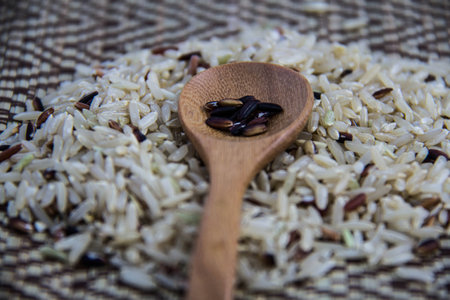 Rice in wooden spoonの写真素材