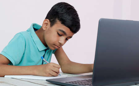 Cute Asian child learning class study online with video call from tablet at home .Social distancing...