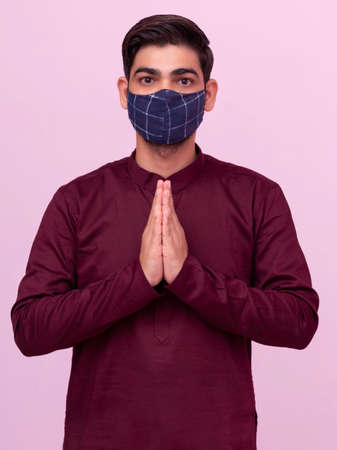 Indian man namaste gesture with mask.の写真素材