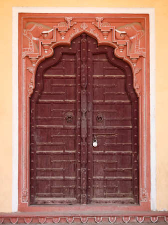 Wooden gate of art work Door in City Palace Jaipur,Rajasthan, India.の写真素材