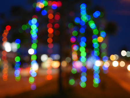 Blurred lights on Christmas. Tree by the wayside Was decorated with multicolored lightsの写真素材