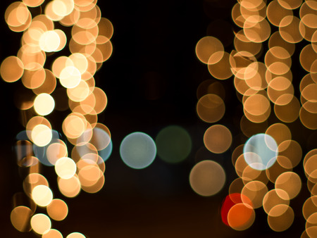 Blurred lights on night time. Background and circle bokeh for christmas and New year festival.の写真素材