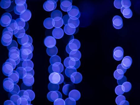 Blurred lights on night time. Background and circle bokeh for christmas and New year festival.の写真素材