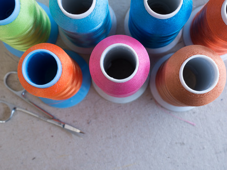 Closeup spools and colored thread sewing for craftsman work.Selective focus colorful thread ,silkの写真素材